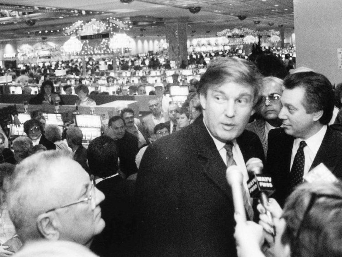 Donald Trump et al. sitting in front of a crowd