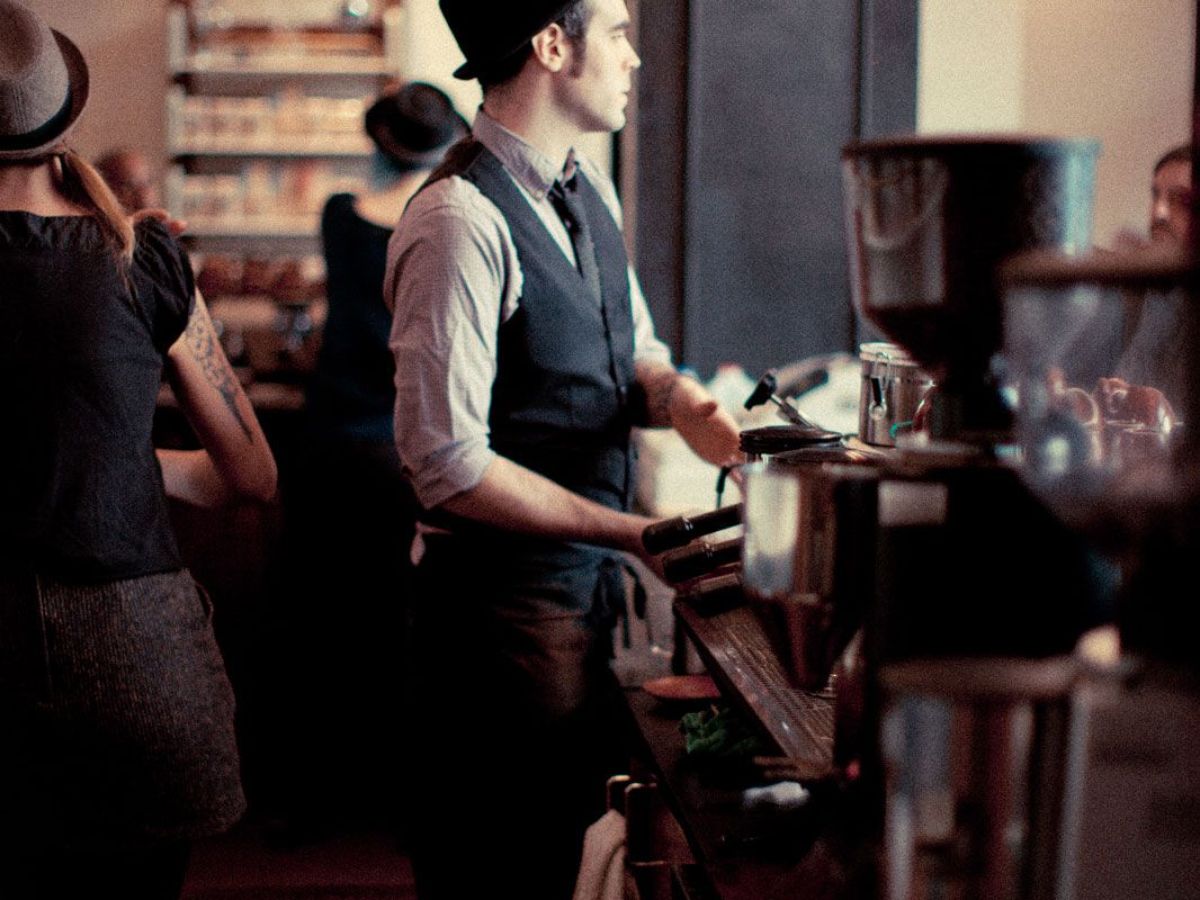 a group of people in a kitchen