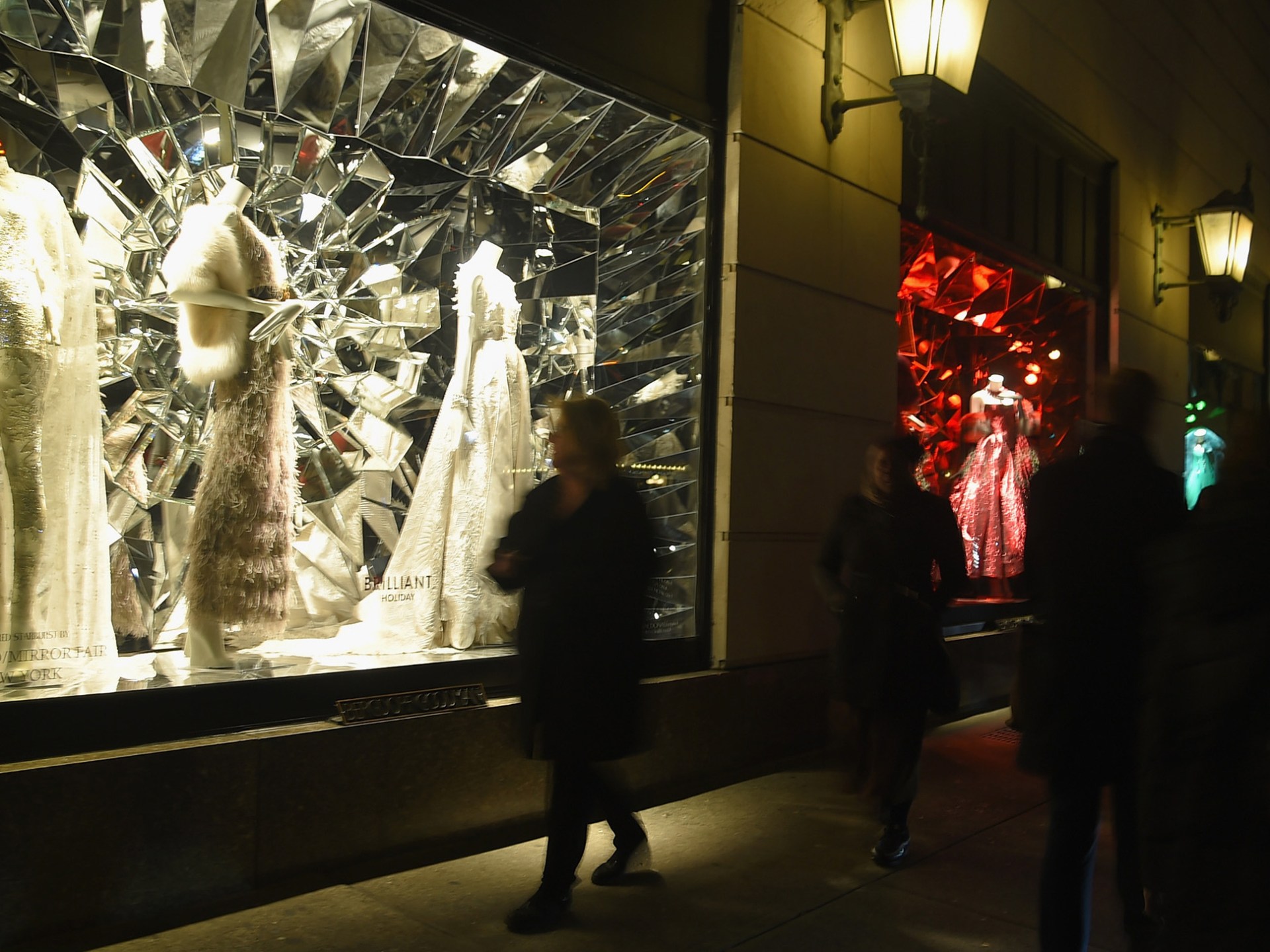 a group of people standing in front of a mirror posing for the camera