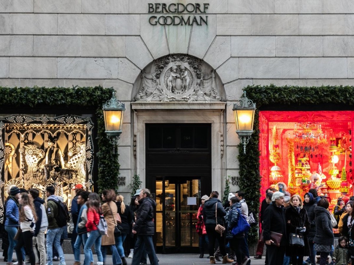 a group of people walking in front of a building